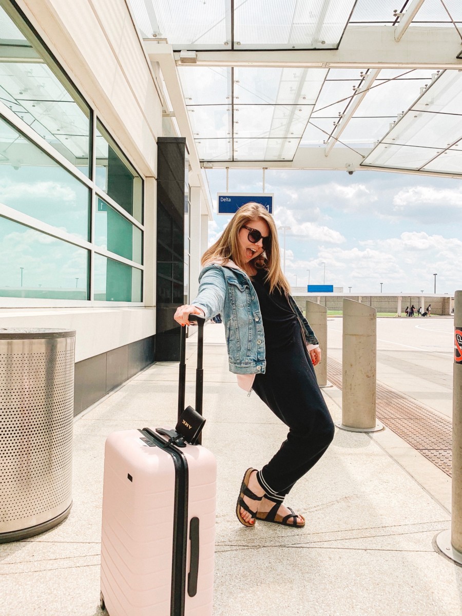 Allie holding a suitcase traveling to Santiago Chile